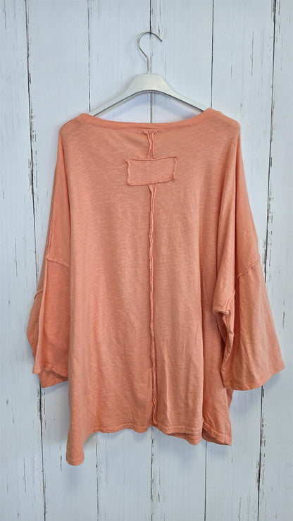 Orangefarget topp med glitterprint
