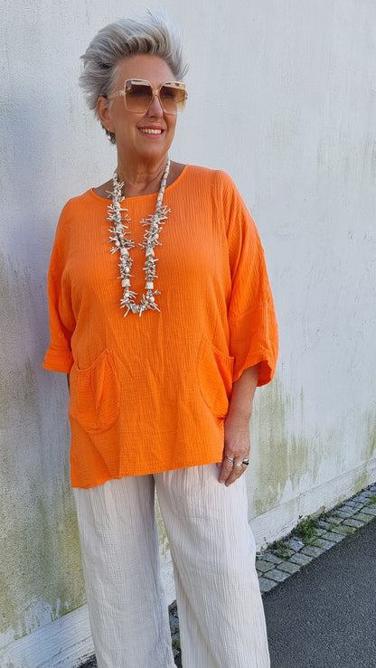 Ina vaffled topp med lommer orange