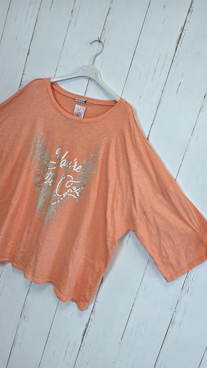 Orangefarget topp med glitterprint