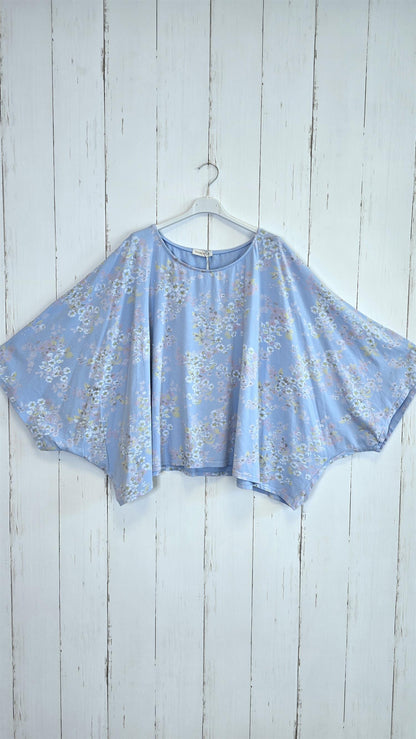 Blomstret poncho-topp blå