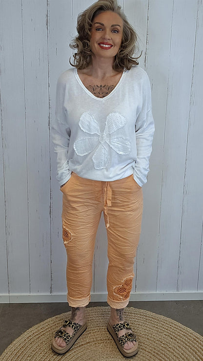 Alma bukse med blomst orange