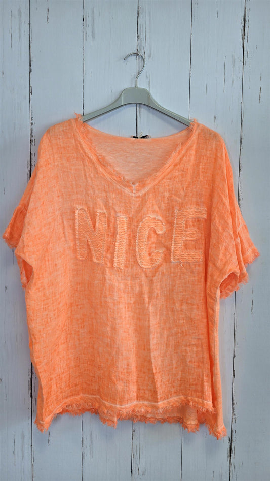 Orange oversized topp med “NICE”