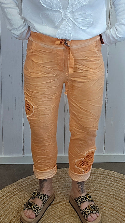 Alma bukse med blomst orange