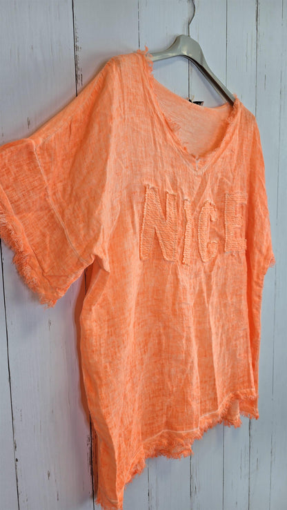 Orange oversized topp med “NICE”