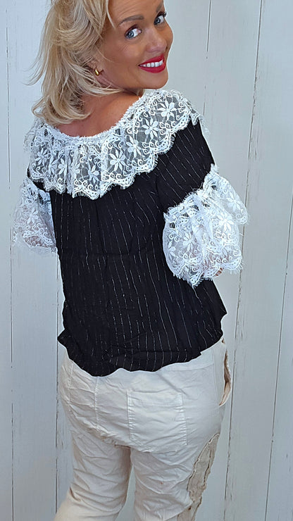 Bluse med blonder svart