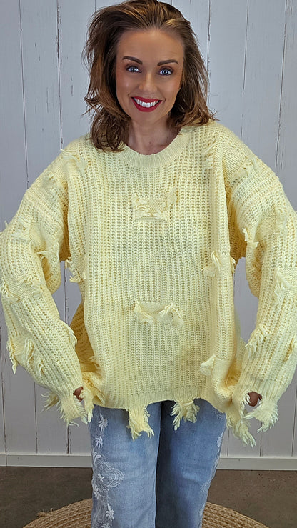 Selma Strikkegenser med rå detaljer gul