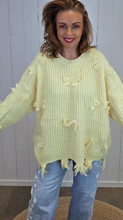 Selma Strikkegenser med rå detaljer gul